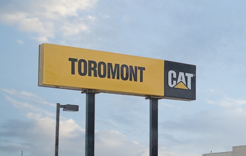 sign of toromont CAT, blue sky cloudy background